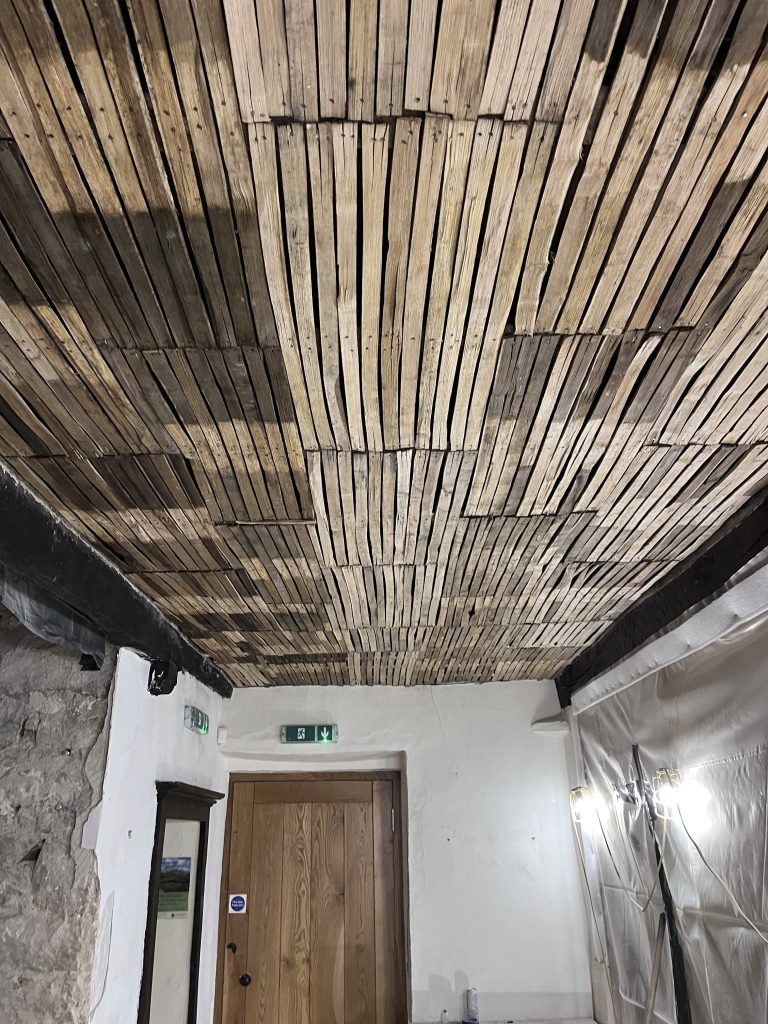 New oak laths affixed to a ceiling ready for plastering