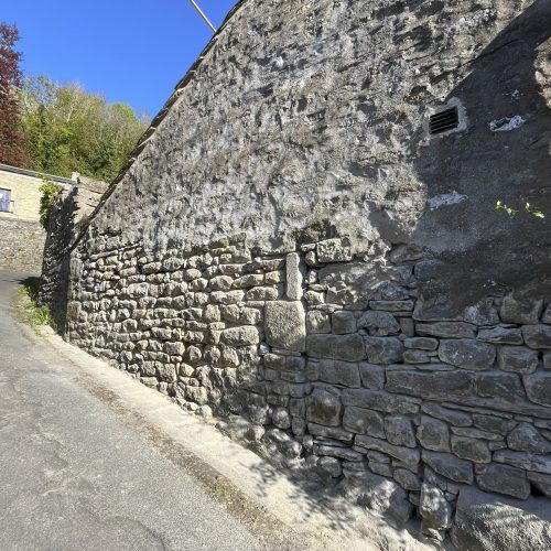 Lower section of the north gable wall at The Folly raked out for repointing